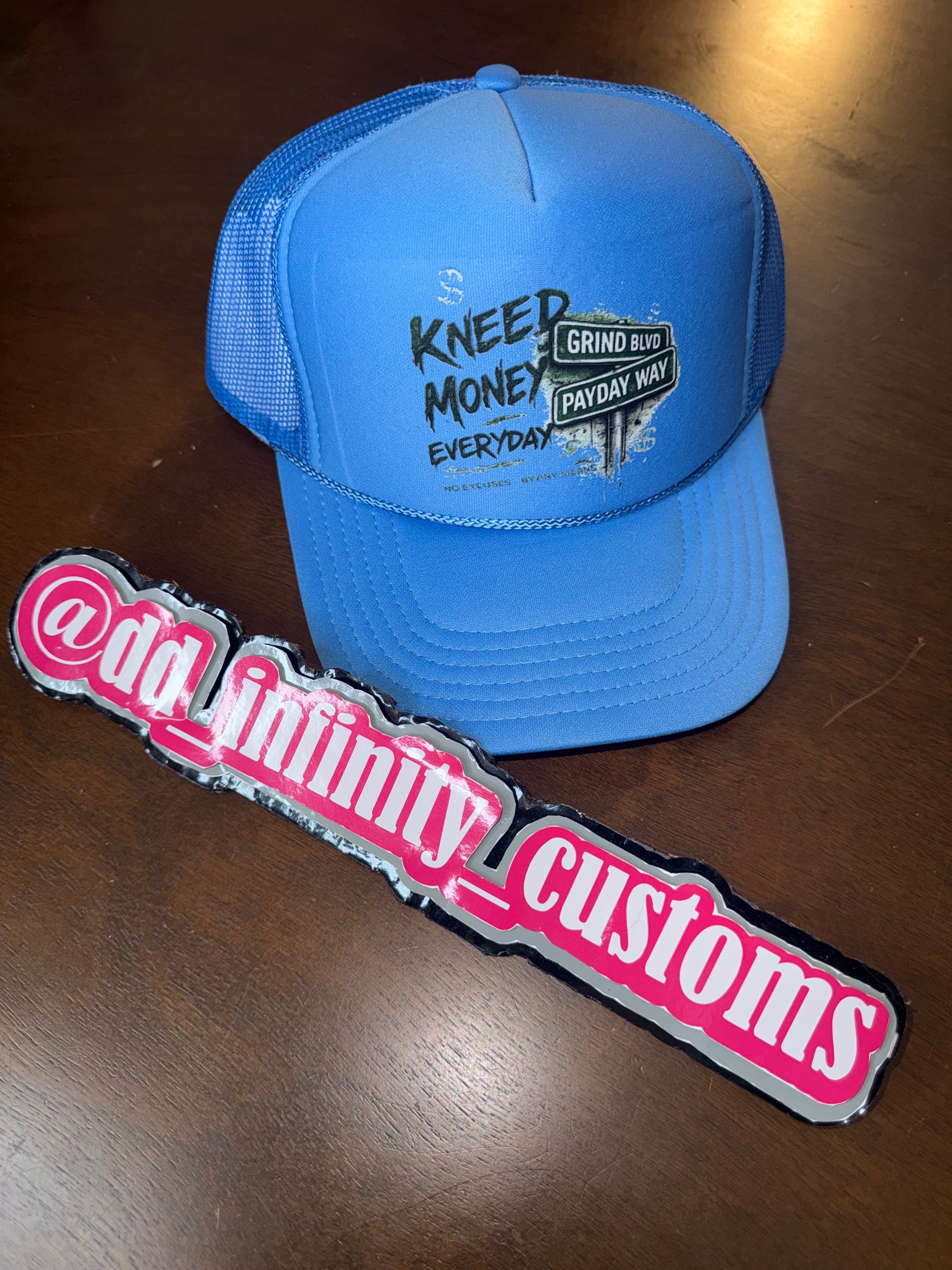 Kneed Money Trucker Hat