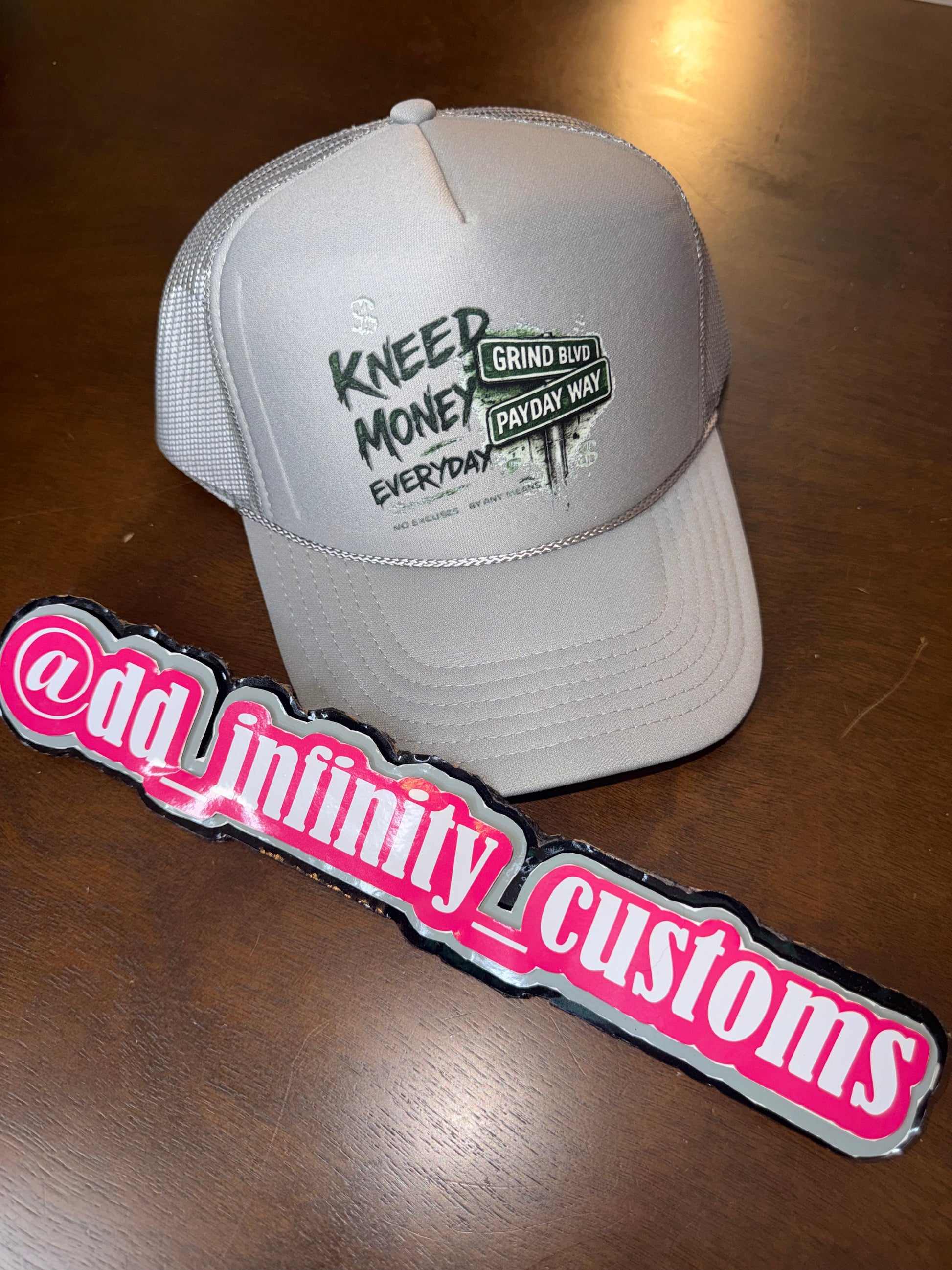 Kneed Money Trucker Hat