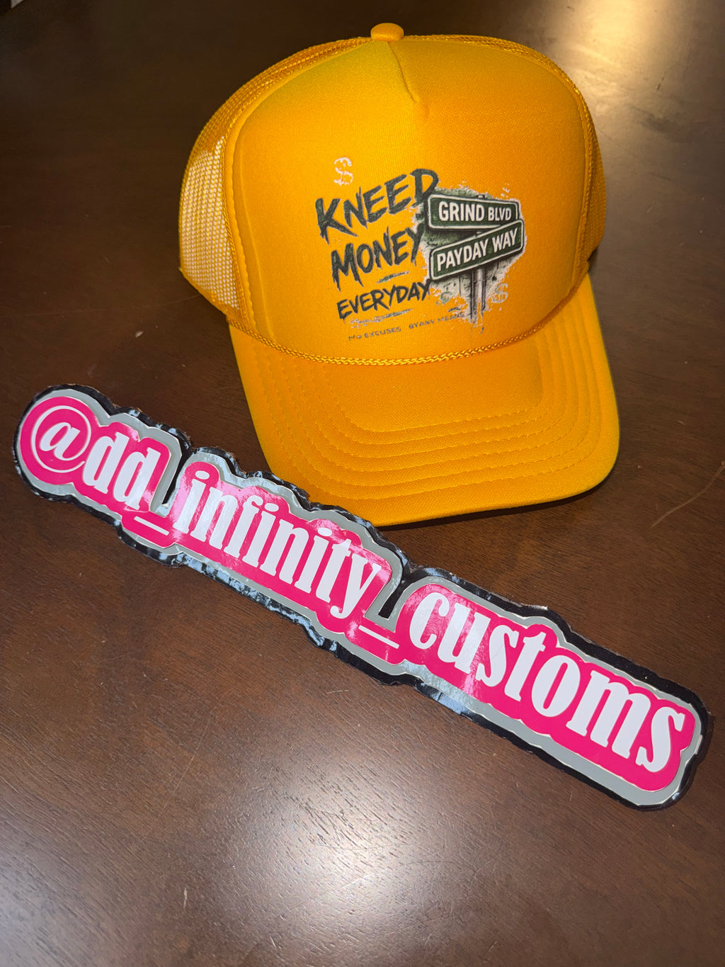 Kneed Money Trucker Hat