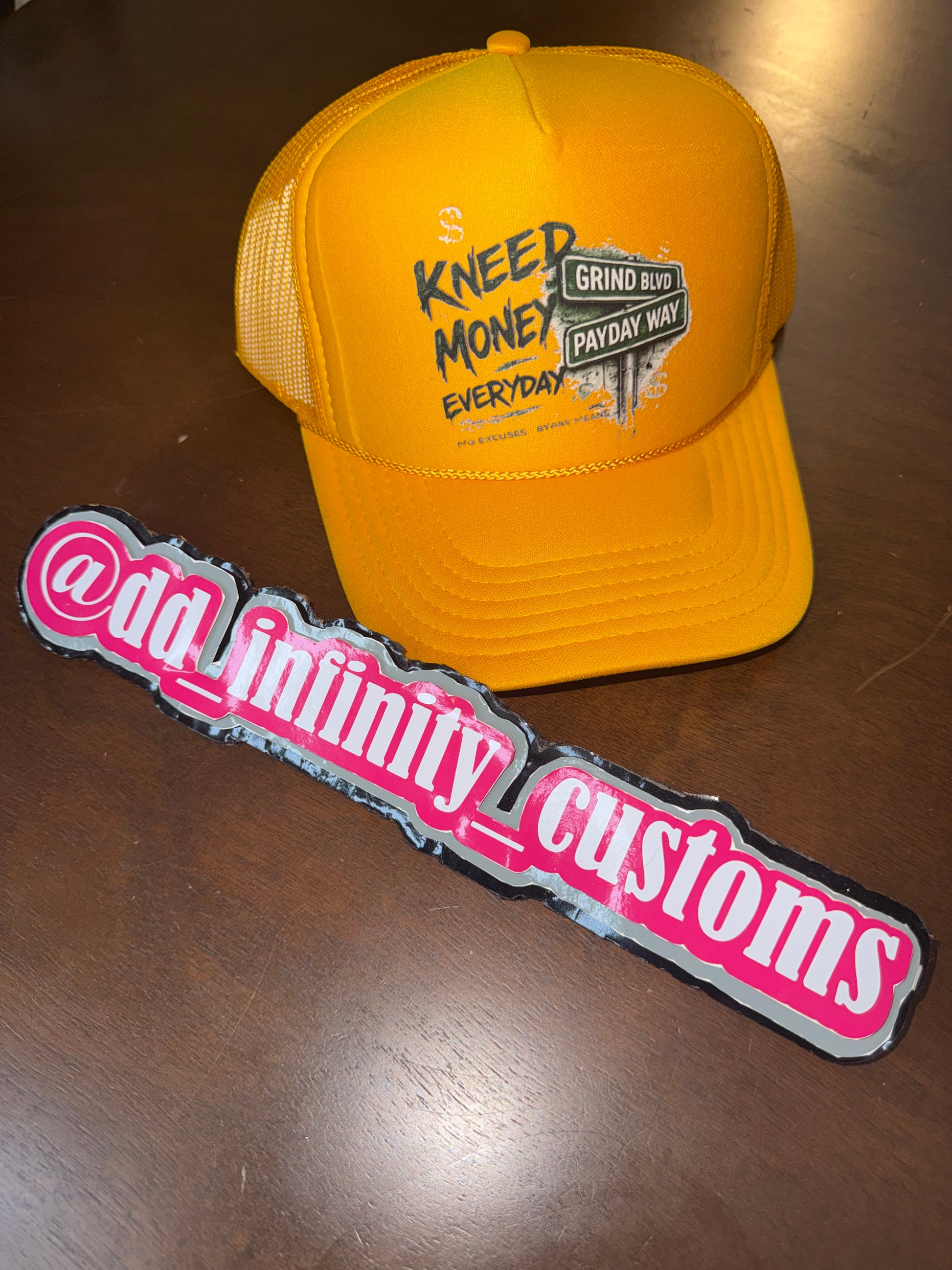 Kneed Money Trucker Hat