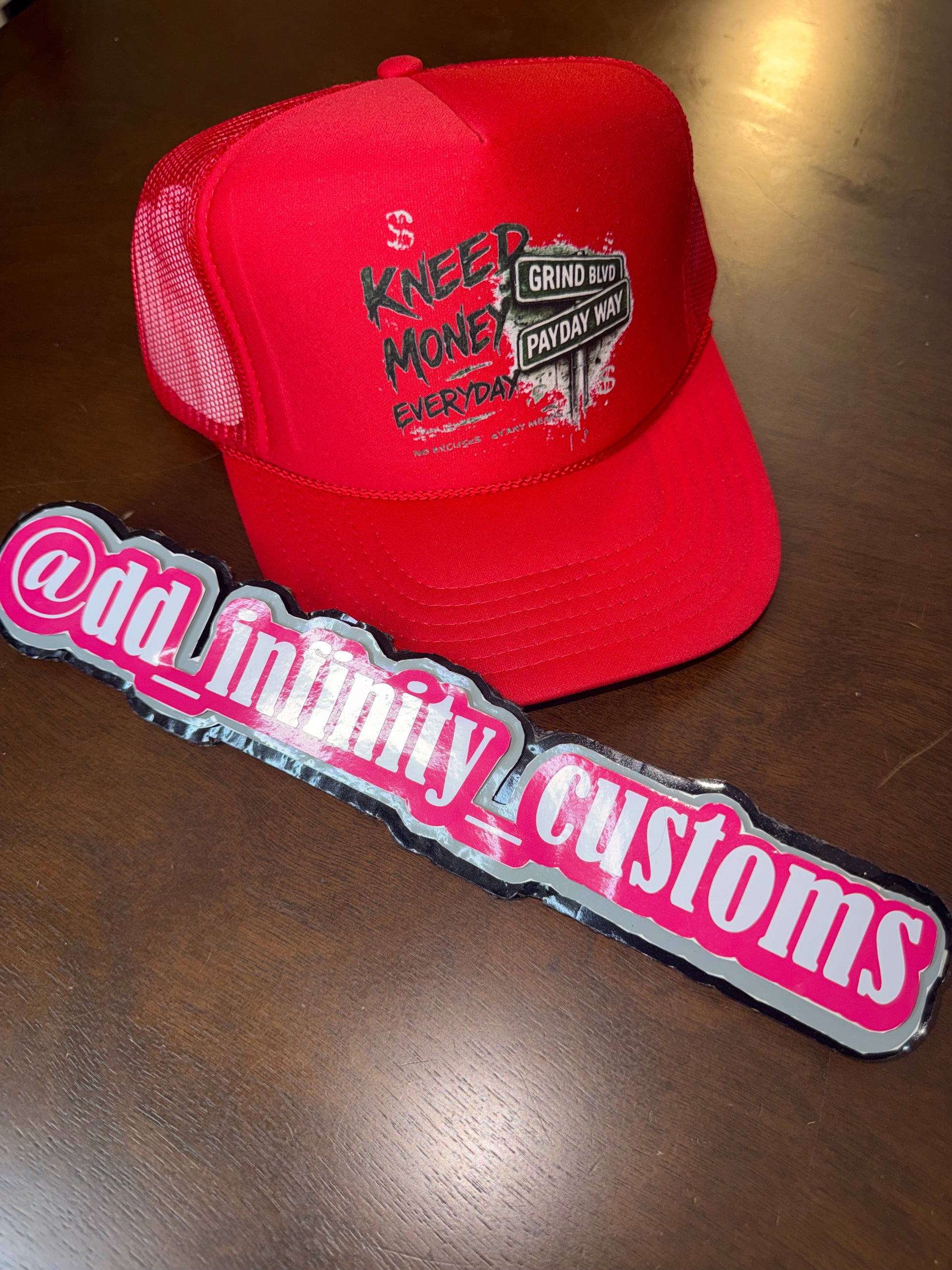 Kneed Money Trucker Hat