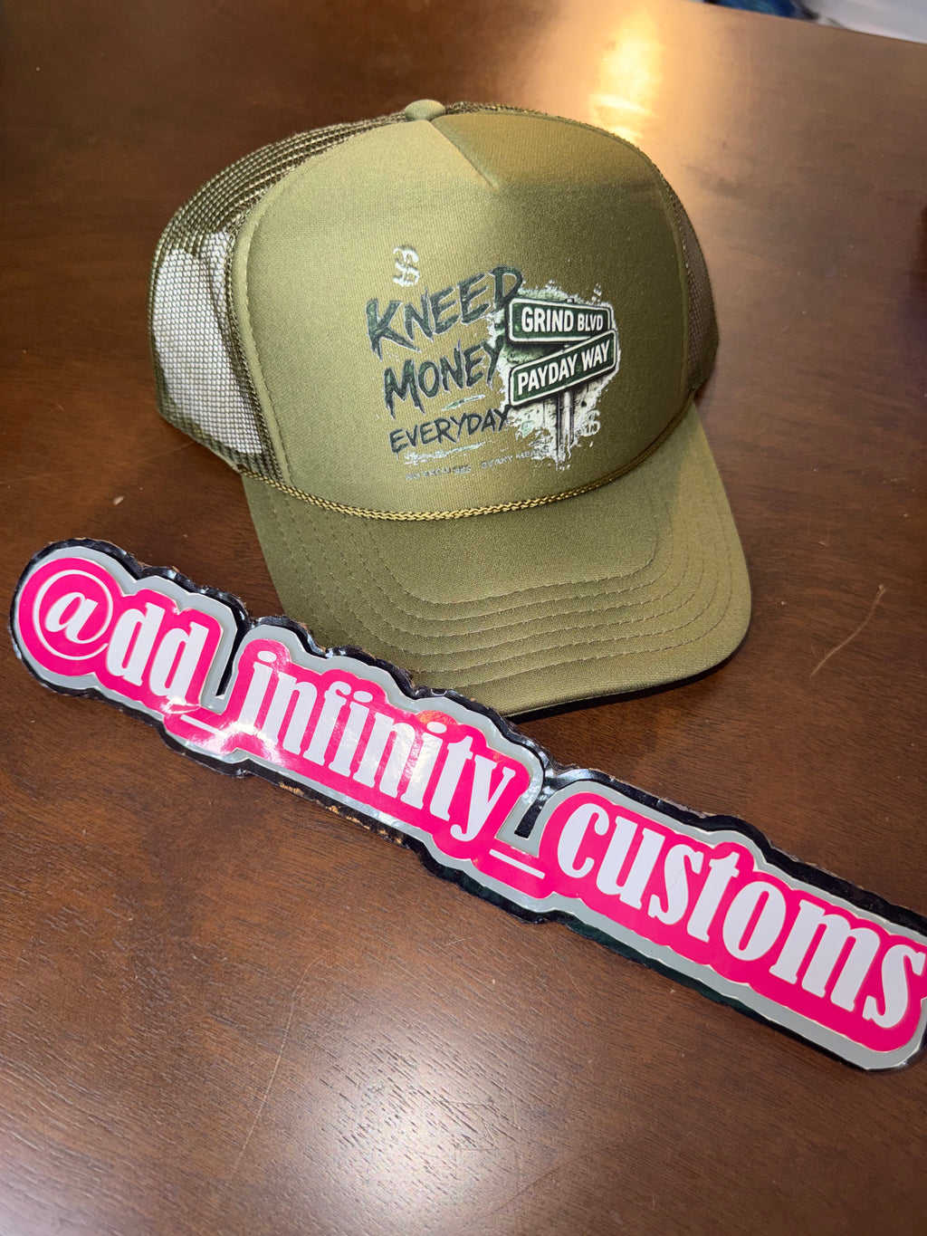 Kneed Money Trucker Hat