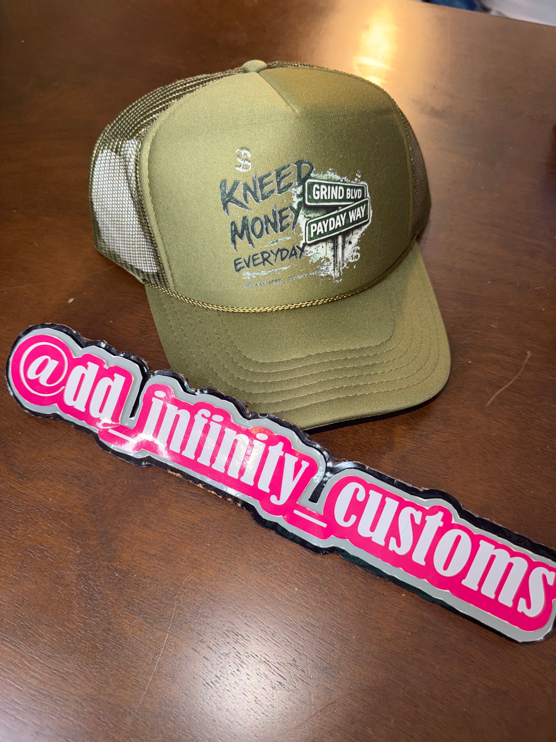 Kneed Money Trucker Hat